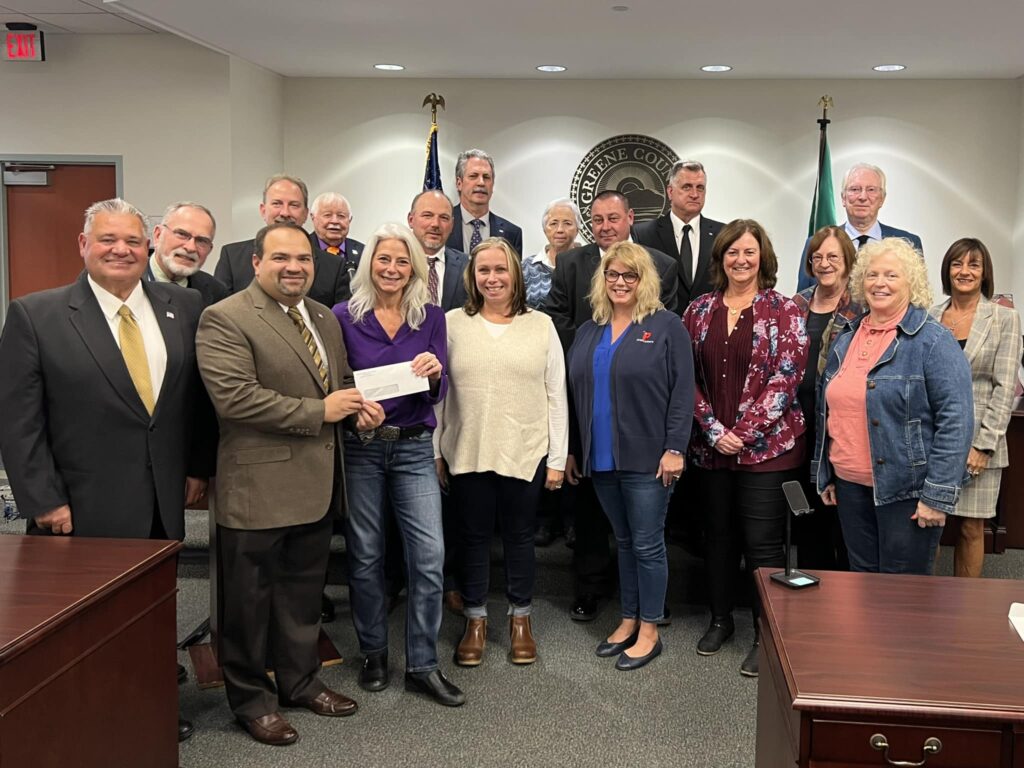 group of of people at legislature with donation check